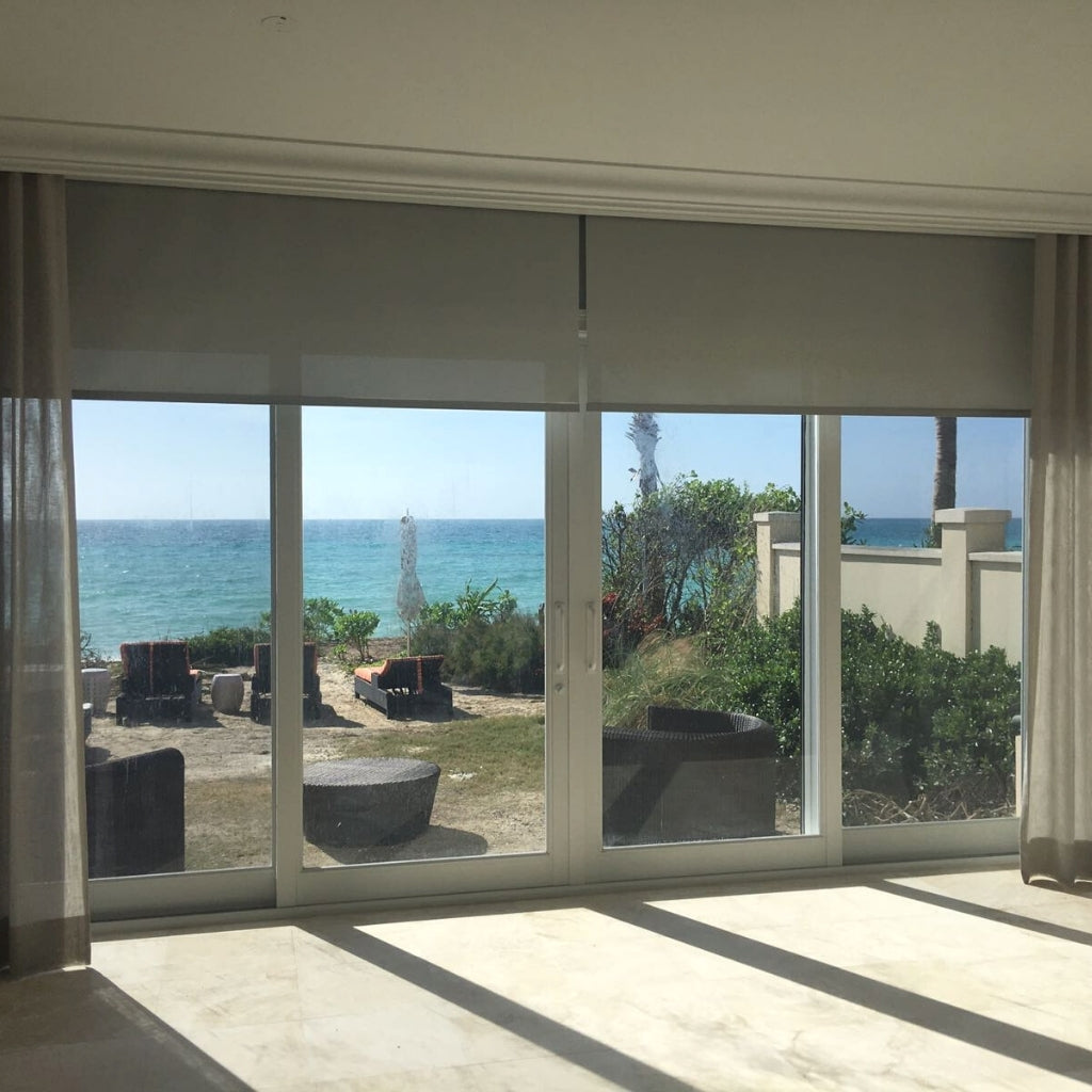 wide windows with a view to the miami becah and sea. 
